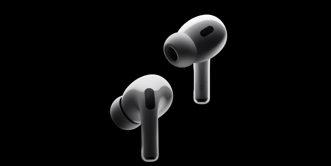 AirPods Pro 2 fora da caixa num fundo preto.